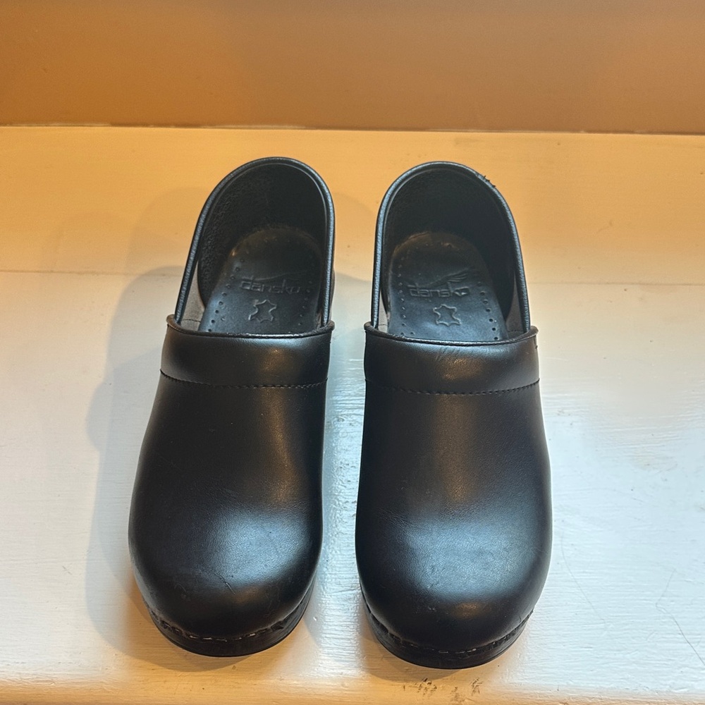 Dansko Black Leather Slip-On Clogs